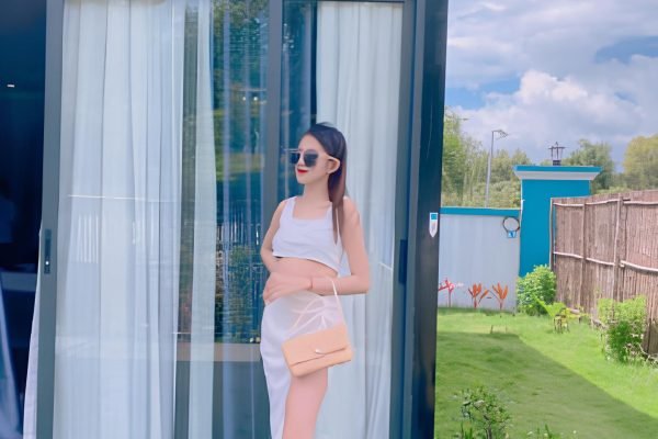 Woman is standing in front of boutique villa at damnak borey resort