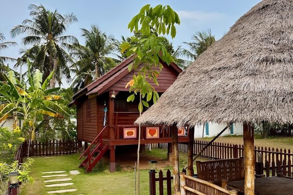 Wooden House with private outside sitting area at Damnak Borey Resort in kampot