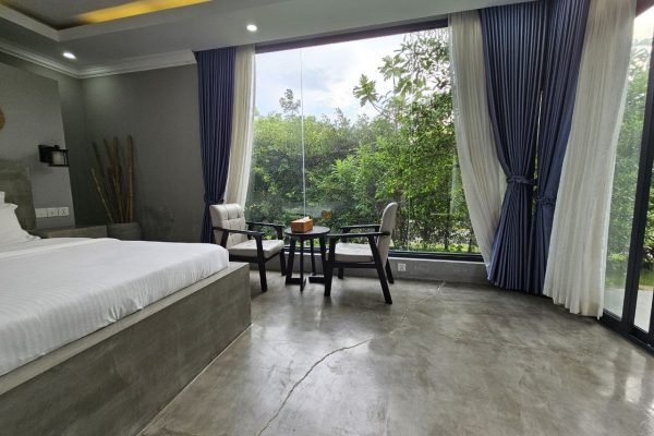 Window view with chill out area at family villa - Damnak borey resort kampot