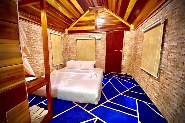 Wooden House inside bed view at Damnak Borey Resort in kampot